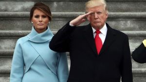 President Donald Trump with first lady Melania Trump and Major General Bradley Becker review troops in Washington.