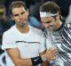 Great players, great men: Rafael Nadal congratulates Roger Federer on his Australian Open triumph. 