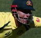 AUCKLAND, NEW ZEALAND - JANUARY 30: Marcus Stoinis of Australia makes a run as Lockie Ferguson of New Zealand looks on ...