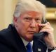 President Donald Trump speaks on the phone with Prime Minister of Australia Malcolm Turnbull in the Oval Office of the ...