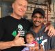 Danny Green with an Indigenous fan and his daughter ahead of Friday's fight.