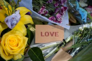 Tributes left outside the RACV club in Bourke st for victims of Friday's rampage.