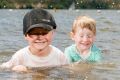 Fyn 4, Marlow, 3, and Noah Butler, 6, beating the heat in Lake Burley Griffin before the school holidays end.