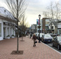 In this Thursday, Jan. 26, 2017 photo, a woman walks near shops in downtown Westport, Conn. A town-sponsored essay contest on the topic of white privilege has stirred controversy in the affluent, overwhelmingly white town on Connecticut's shoreline. (AP Photo/Michael Melia)