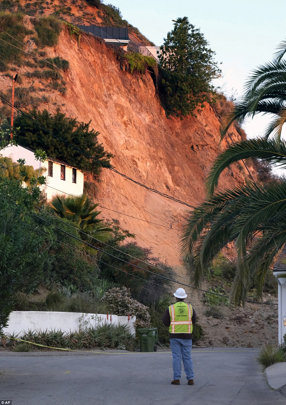 The landslide sent almost 20 tons of debris cascading down the hillside. It covered the street and blocked off access to Lovato's home and her two neighbors