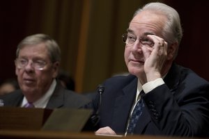 Health and Human Services Secretary-designate, Rep. Tom Price, R-Ga., right, accompanied by Sen. Johnny Isakson, R-Ga., pauses while testifying on Capitol Hill in Washington, Tuesday, Jan. 24, 2017, at his confirmation hearing before the Senate Finance Committee.