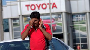 A Toyota worker shares the news on Tuesday afternoon. 