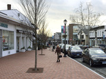 In this Thursday, Jan. 26, 2017 photo, a woman walks near shops in downtown Westport, Conn. A town-sponsored essay contest on the topic of white privilege has stirred controversy in the affluent, overwhelmingly white town on Connecticut's shoreline. (AP Photo/Michael Melia)