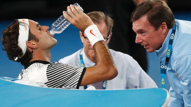 Roger Federer receives treatment during the Australian Open final against Rafa Nadal.