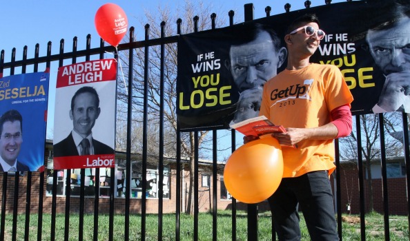 GetUp! supporter Girish Sagaram hands out how-to-vote cards at North Ainslie Primary School, ACT.