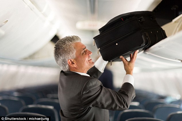 Fliers who want the cheapest fare that American Airlines and United Airlines offer will have to leave their rolling carry-on bags at home and opt for something small enough to squeeze under a seat (stock image)