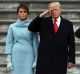 President Donald Trump with first lady Melania Trump and Major General Bradley Becker review troops in Washington.