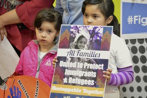 Jocelynn Lujan, 6, left, and her sister, Jennifer, 8, attend a news conference in Albuquerque, N.M., Wednesday, Jan. 25, 2017