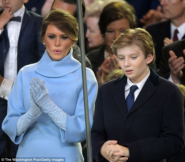 Staying put: First lady Melania Trump, 46, may not move into the White House while her husband is in office (Melania and son Barron at the inauguration last month above)