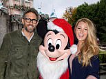 ANAHEIM, CA - DECEMBER 16:  In this handout photo provided by Disney Parks, Ryan Reynolds and Blake Lively meet Mickey Mouse at Sleeping Beauty's Winter Castle at Disneyland park December 16, 2016 in Anaheim, California.  (Photo by Richard Harbaugh/Disneyland Resort via Getty Images)