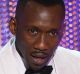 Mahershala Ali accepts the award for outstanding performance by a male actor in a supporting role for <i>Moonlight</i> ...