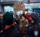 Protesters are surrounded by police officers at John F. Kennedy International Airport in New York.