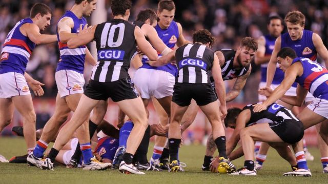 Congestion in the pack during a Collingwood-Bulldogs game last season. The AFL feels it is increasing this year.