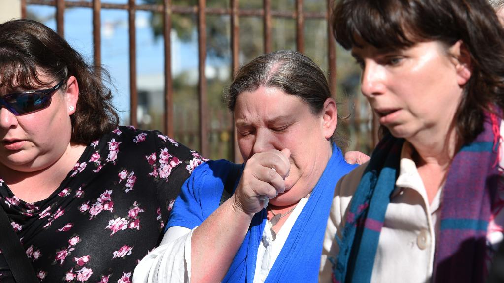 Bridget Klingberg, centre, mother of Briony, leaves the Coroners Court with family after giving evidence into the death of her 10-year-old daughter who died of multiple organ failure from a herpes infection.