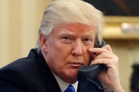 President Donald Trump speaks on the phone with Prime Minister of Australia Malcolm Turnbull in the Oval Office of the ...