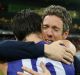 Full of heart: Injured Bulldogs skipper Bob Murphy embraces his stand-in, Easton Wood, after the Bulldogs beat GWS.