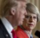Theresa May listens as Donald Trump speaks during a joint news conference.
