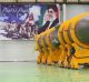 An Iranian missile that state media says is a Sejil 2 surface-to-surface missile in front of a banner with a picture of ...