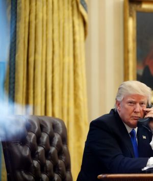 President Donald Trump speaks on the phone with Prime Minister of Australia Malcolm Turnbull in the Oval Office of the ...