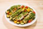 Baked herb-crusted salmon with zucchini & cherry tomatoes.