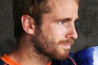 Kane Williamson enjoys a cup of tea during a rain delay in Napier.