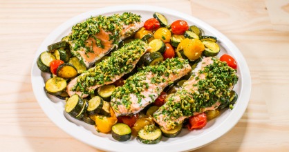 Baked herb-crusted salmon with zucchini & cherry tomatoes.