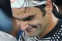 Roger Federer of Switzerland (R) celebrates winning the Australian Open final against Rafael Nadal.