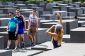 Tourists taking photos at the Holocaust Memorial in Berlin.