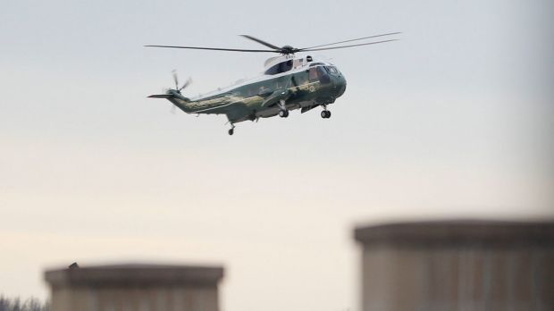 Marine One, with US President Donald Trump aboard, lands at Dover Air Force Base  to meet with family  of William "Ryan" ...