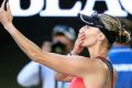 Candid and on camera: Croatia's Mirjana Lucic-Baroni takes a selfie on her phone as she leaves Rod Laver Arena.