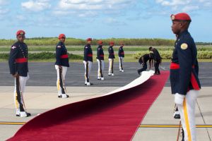 The wind blows the red carpet moments before President Jocelerme Privert of Haiti arrives at the Punta Cana ...