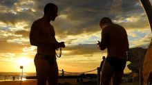 Swimmers rinse off at Clovelly Beach before the temperatures rise in Sydney on Tuesday morning.