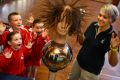 Students learn about the hair-raising effects of static electricity.