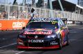 Shane Van Gisbergen crosses the finish line to win the Supercars Drivers Championship for the Sydney 500 on December 4, 2016.