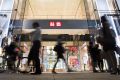 Uniqlo's sales are growing strongly thanks to new store openings but its profits are under pressure.