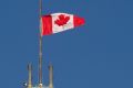 The flag flies at half-mast on the Peace tower in Ottawa. 