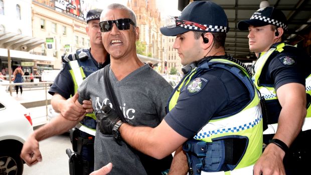 A man claiming he was at one point homeless yelled at the homeless at Flinders Street Station. The police took him away.