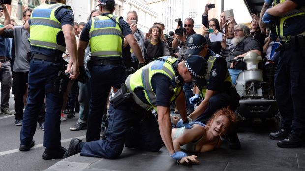 Police arrest one of the rough sleepers.