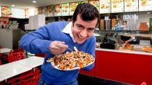 Sam Dastyari downs a meaty halal snack pack. 