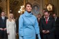 First lady Melania Trump wore a light blue suit, reminiscent of Jackie Kennedy's famous look.