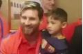 Famous meeting: Murtaza Ahmadi, left, with his plastic bag jumper and with Lionel Messi.