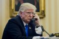 US President Donald Trump speaks on the phone with Malcolm Turnbull on Sunday morning. 