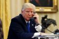 President Donald Trump speaks on the phone with Prime Minister of Australia Malcolm Turnbull in the Oval Office of the ...