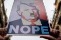 Demonstrators make their way through the streets holding posters during the Women's March in Barcelona.