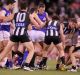 Congestion in the pack during a Collingwood-Bulldogs game last season. The AFL feels it is increasing this year.